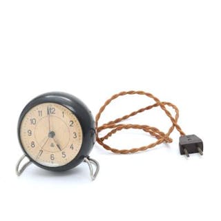 Arne Jacobsen: Alarm clock of black bakelite, patinated dial with