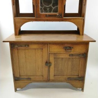 An Oak Arts And Crafts Style Dresser The Raised Back With Lead