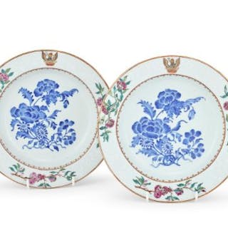 A pair of Chinese Export Famille Rose crested soup bowls