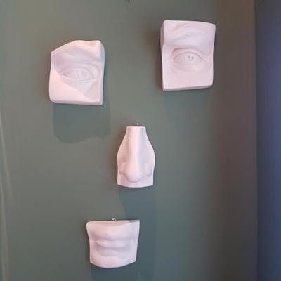 A Plaster Wall Sculpture In The Form Of A Segmented Face Barnebys A Plaster Wall Sculpture In The Form Of A Segmented Face Barnebys
